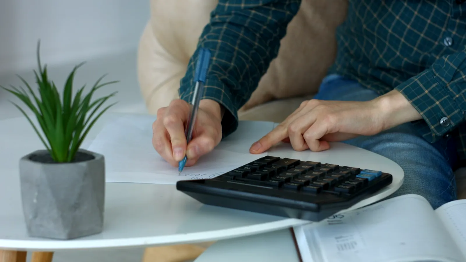 Working through household accounts with a calculator