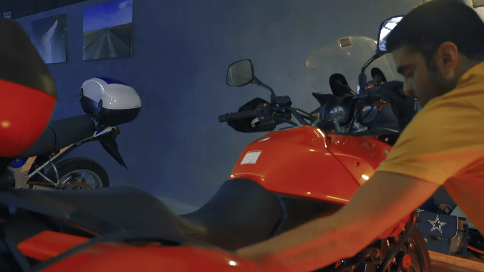 A mechanic checking a motorcycle in the workshop