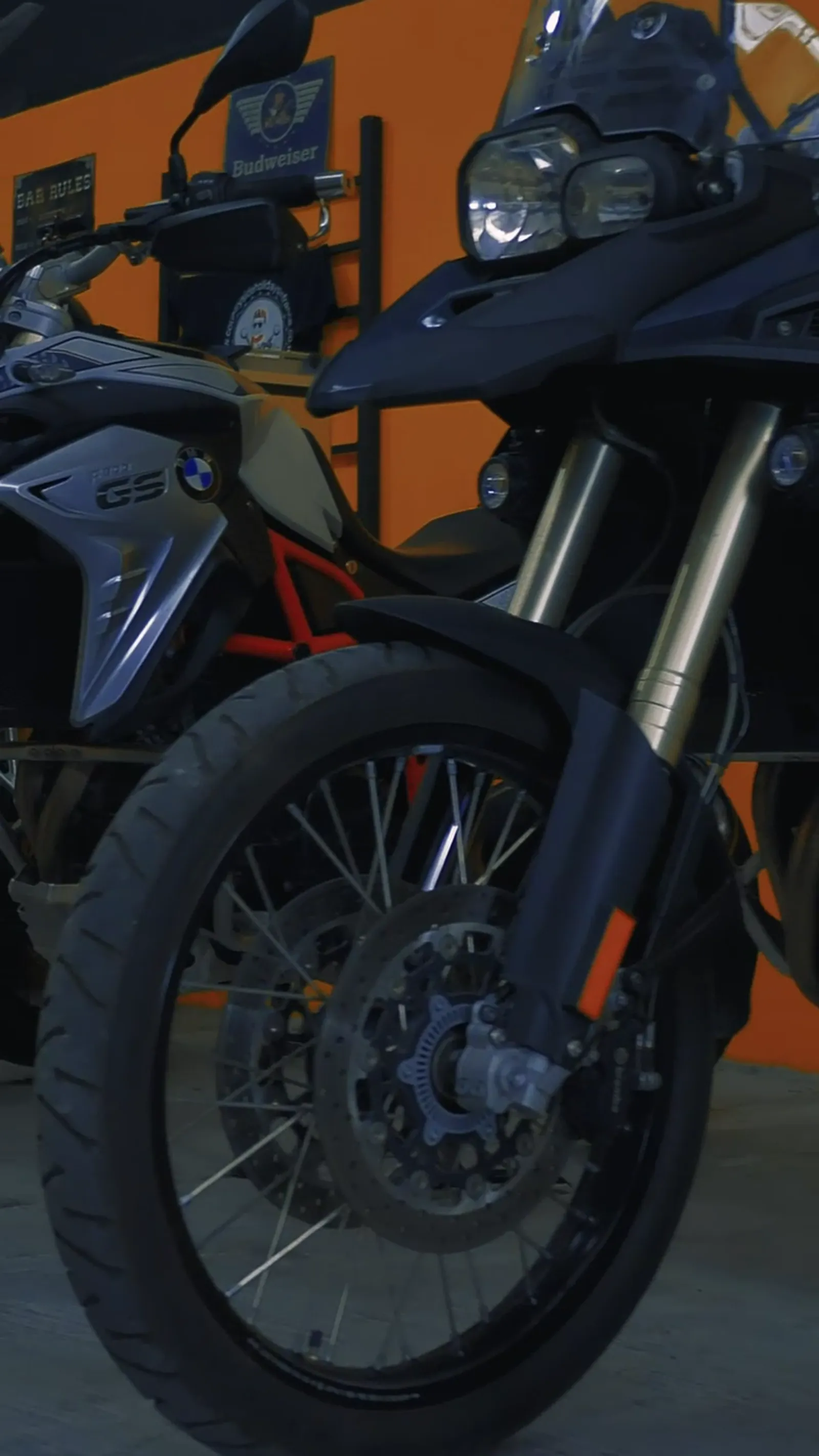 A row of motorcycles waiting in the workshop