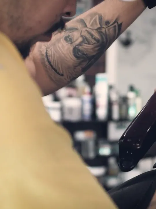 Dom, barber, cutting with clippers