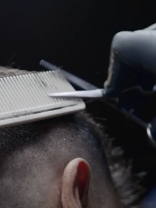 A scissor-over-comb fade