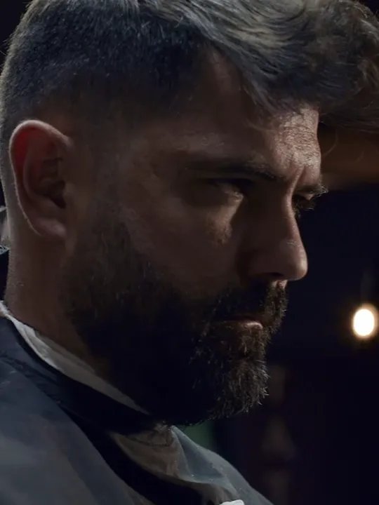 A beard and fade in progress