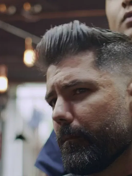 A finished pompadour and beard