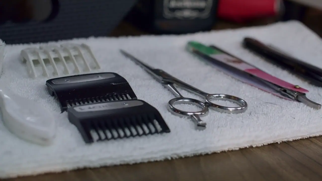 Professional hairdressing tools laid out on a towel