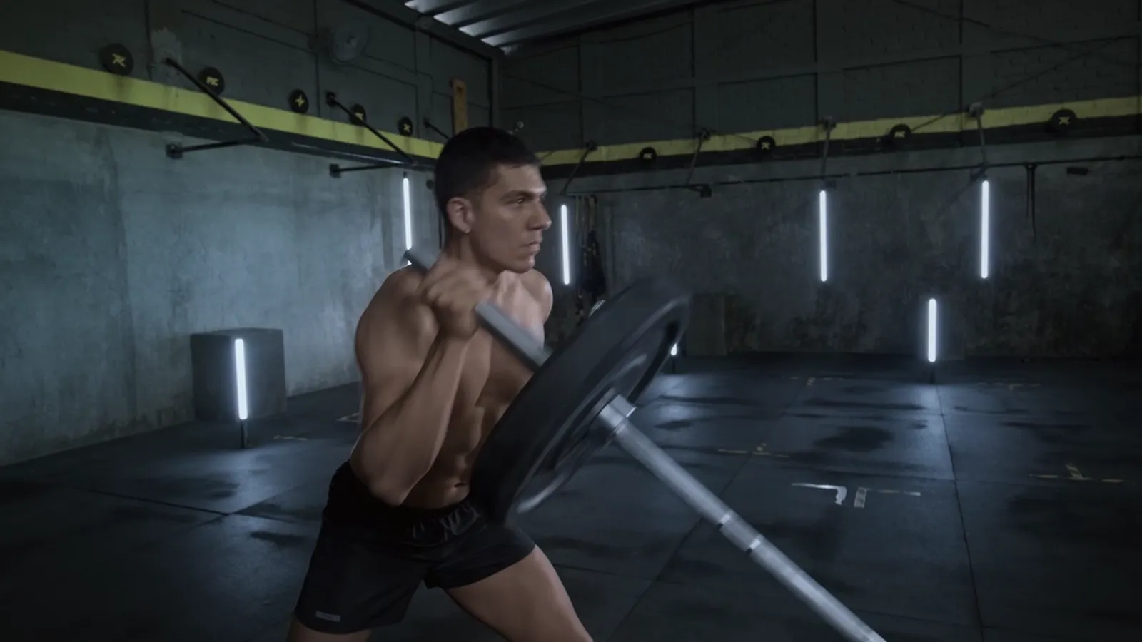 A man lifting a barbell with one arm