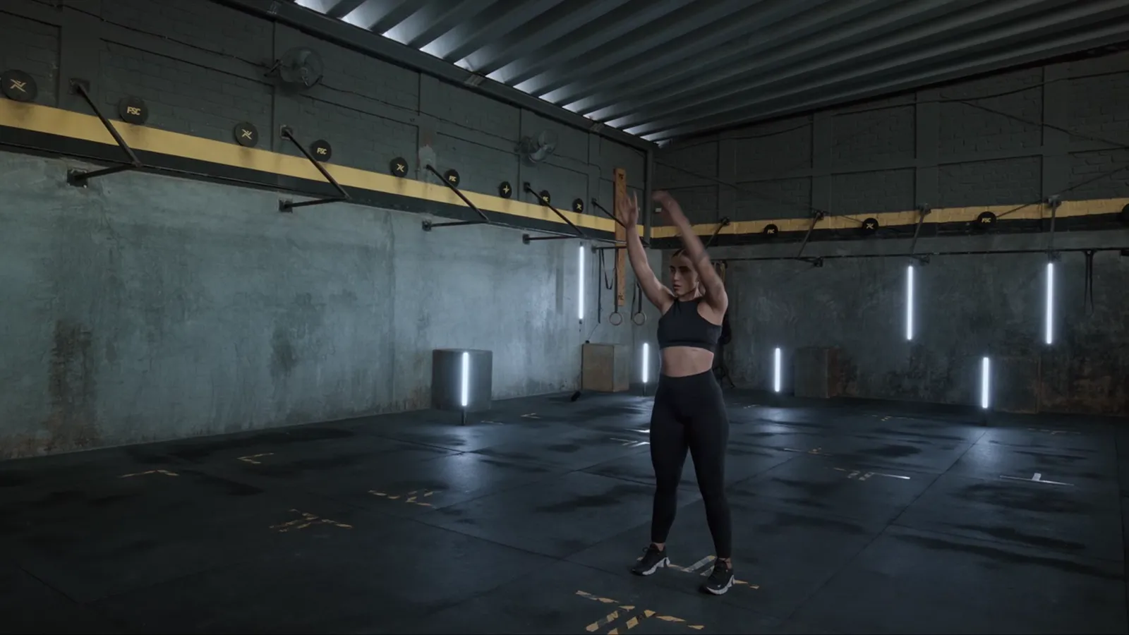 A woman warming up in the gym
