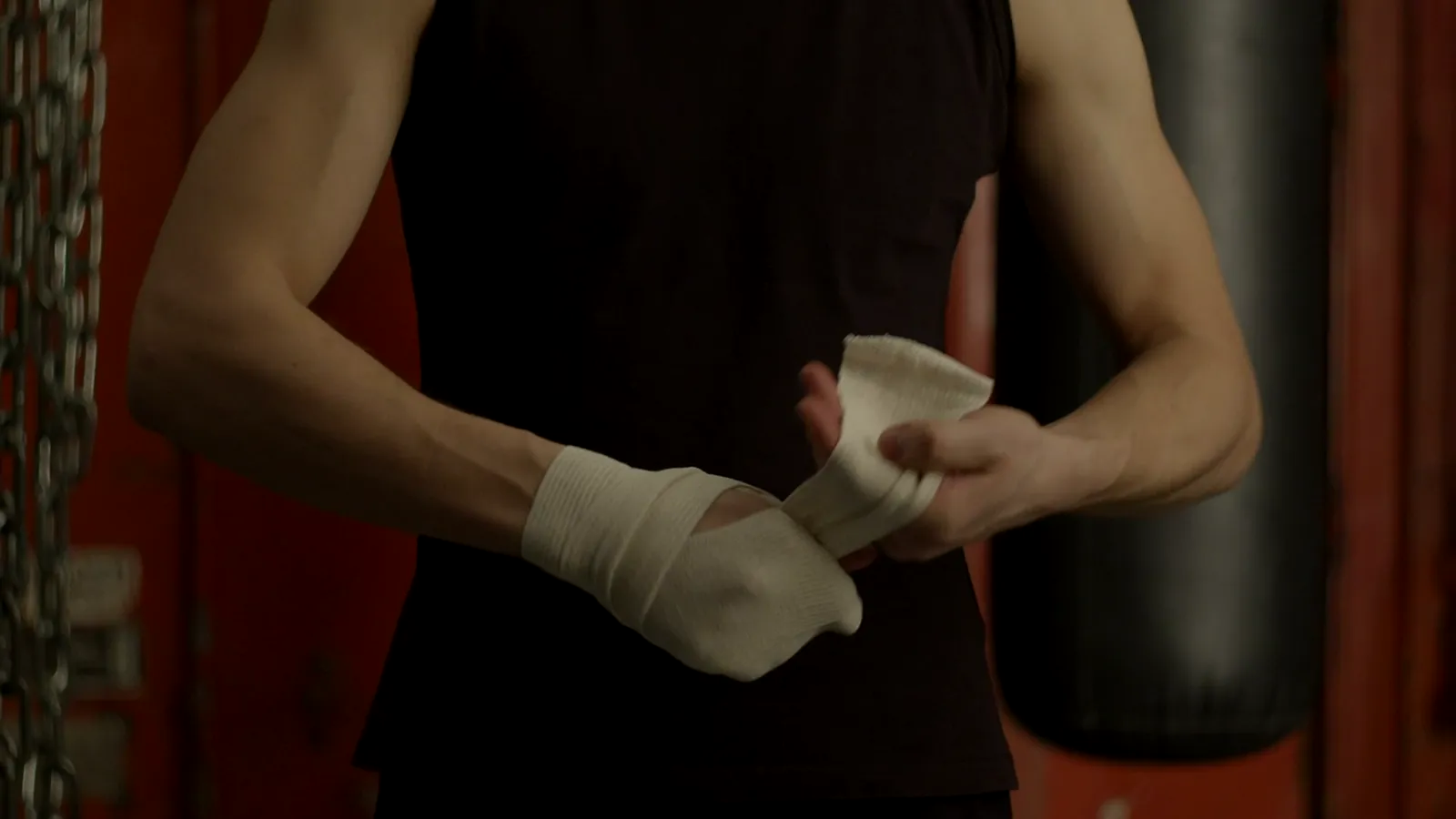 A boxer wrapping his hands