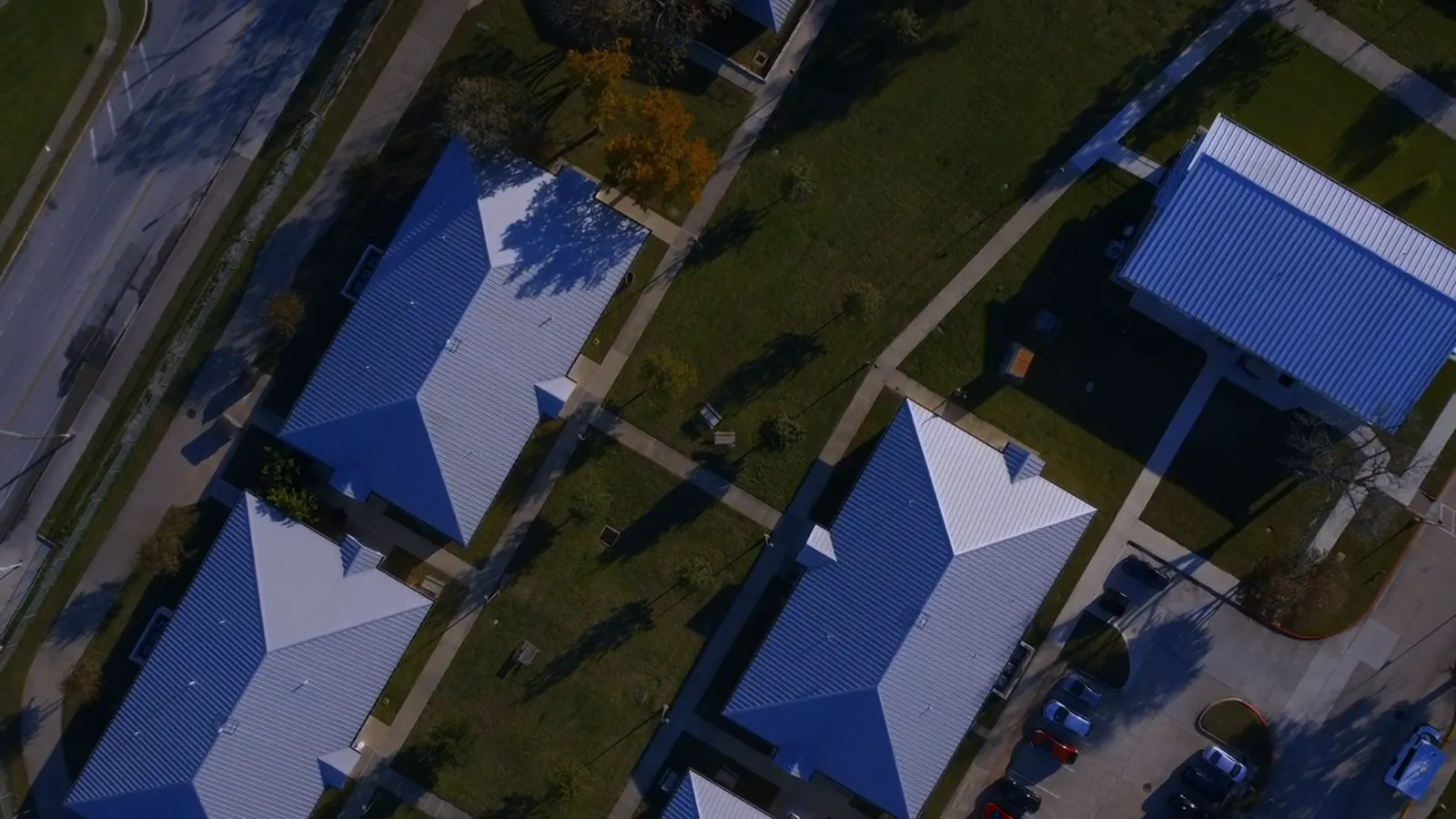 Blue metal roofs along the street from above
