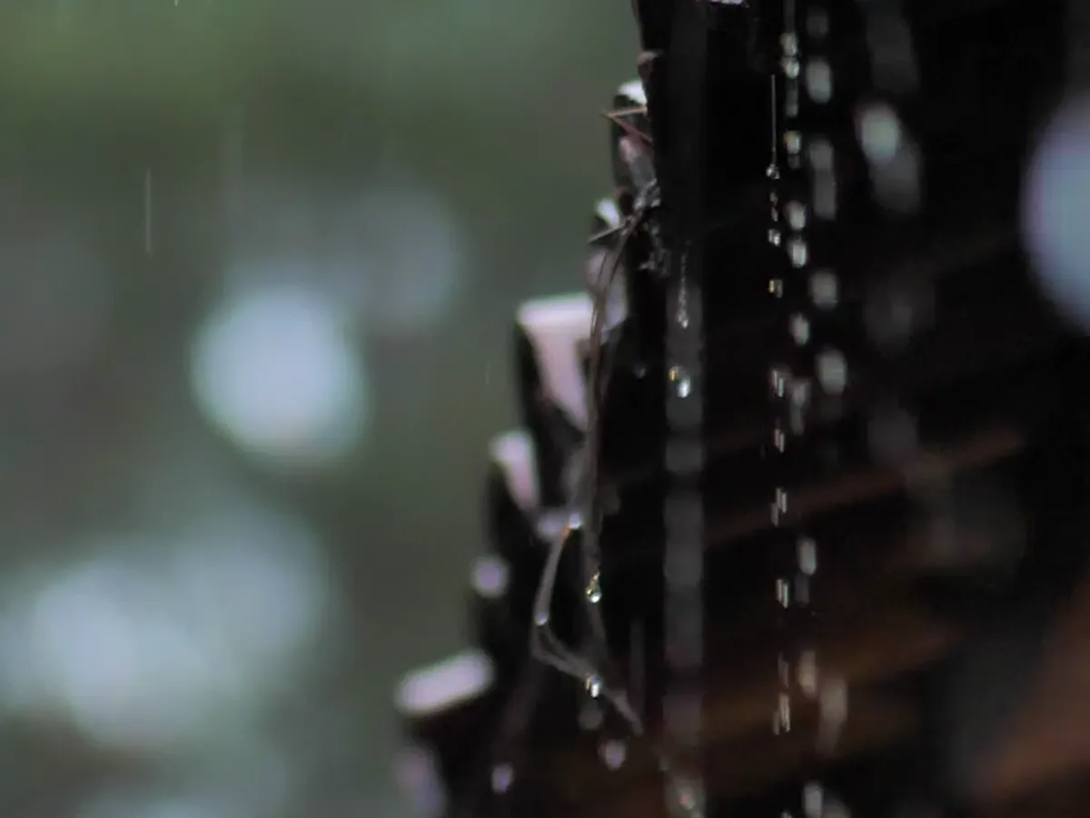Close view of rain running off the roof edge